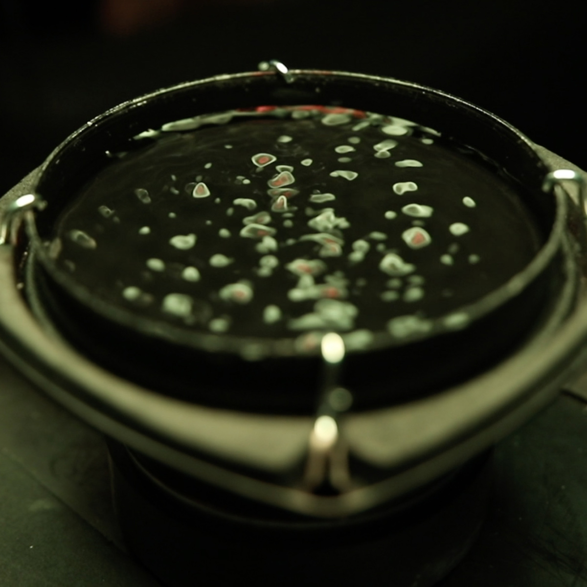 A close up of the wave activity in the water dish
