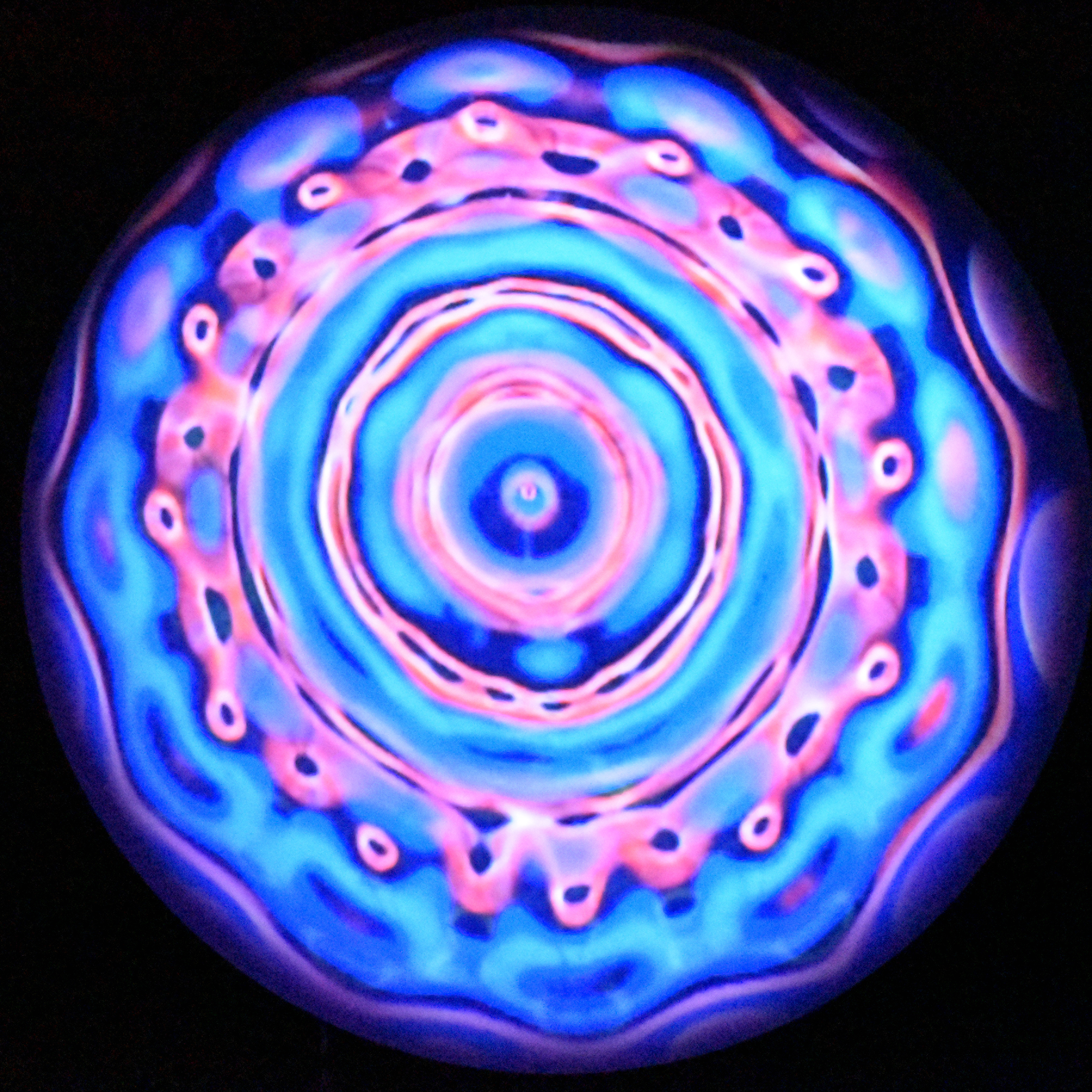 A light blue and pink cymaglyph